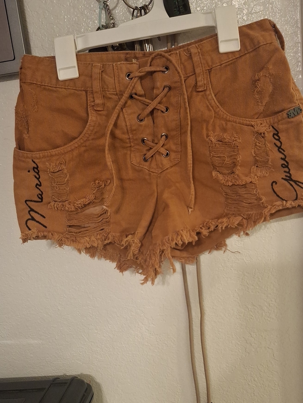 Lace-Up Distressed Women's Jean Shorts in Tan with Script Detail